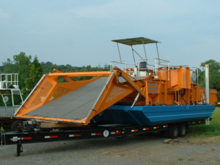 Alphaboats FX-11 Waterweed Harvester on an Alphaboats Transport Trailer
