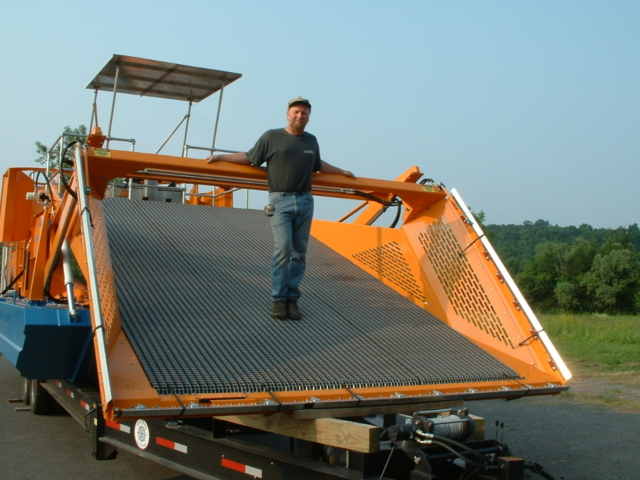 Alphaboats FX-11 Waterweed Harvester displaying it's wide cutting area