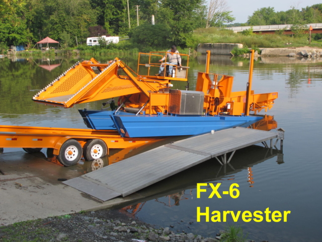 Alphaboats FX6 Waterweed Harvester Launching from Alphaboats Transport Trailer