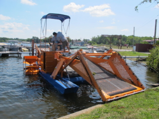 Alphaboats FX7 Waterweed Harvester at Shoreline