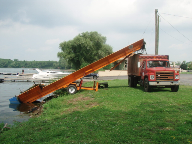 Alphaboats SL6036 Shore Conveyor unloading aquatic weeds